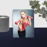 Girl using dumb bells canvas